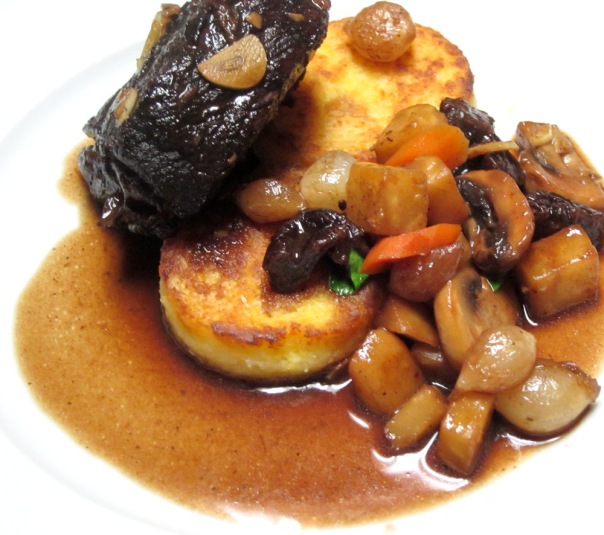 Braised Short Ribs in Cepe-Prune Sauce and Cornmeal Cakes